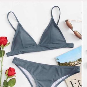 A slate colored bikini swim suit